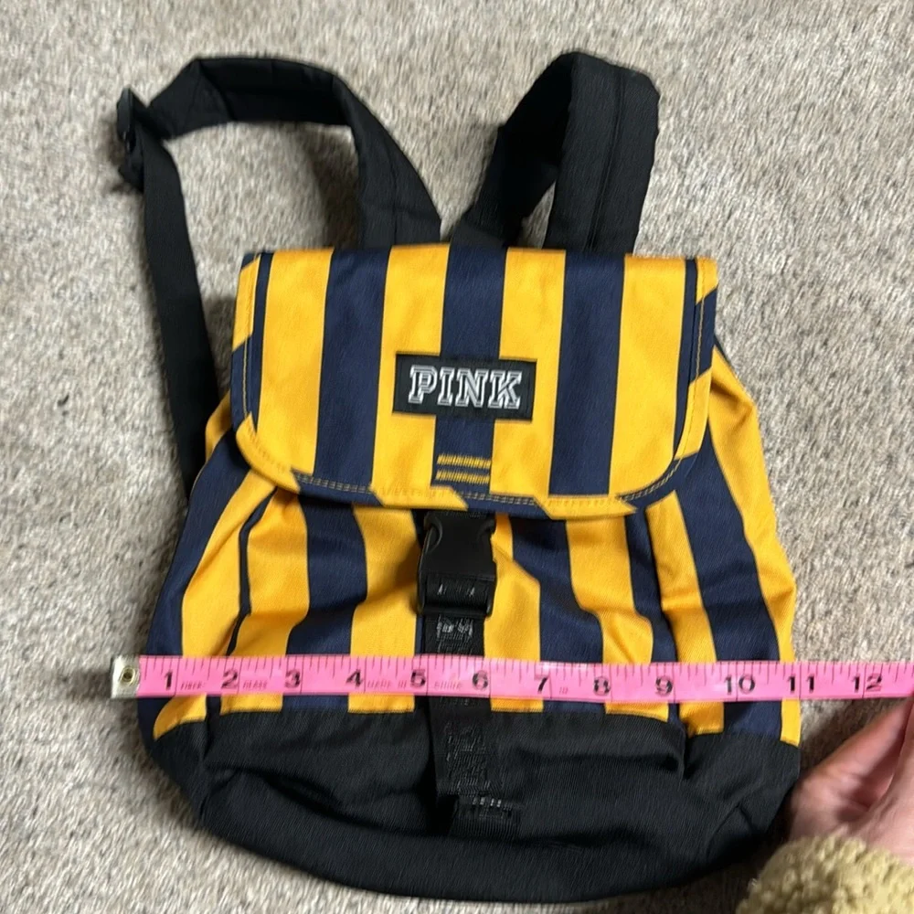 Like New PINK mini backpack navy/yellow stripe drawstring and buckle closure